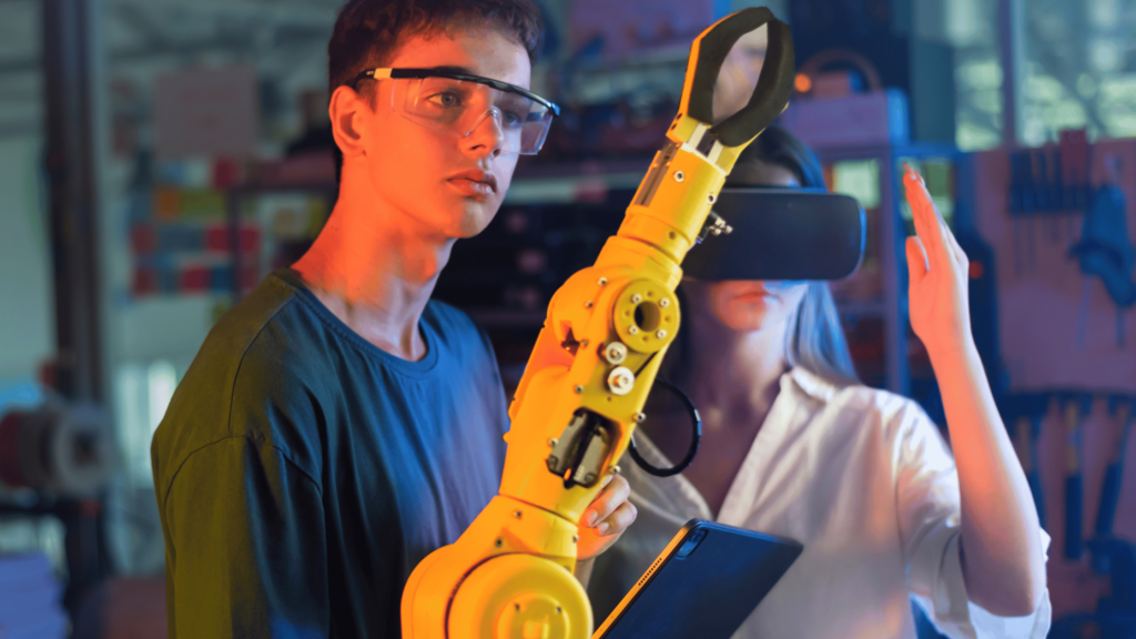 Two engineers using virtual reality and robotic arm for automation and quality control in investment casting.